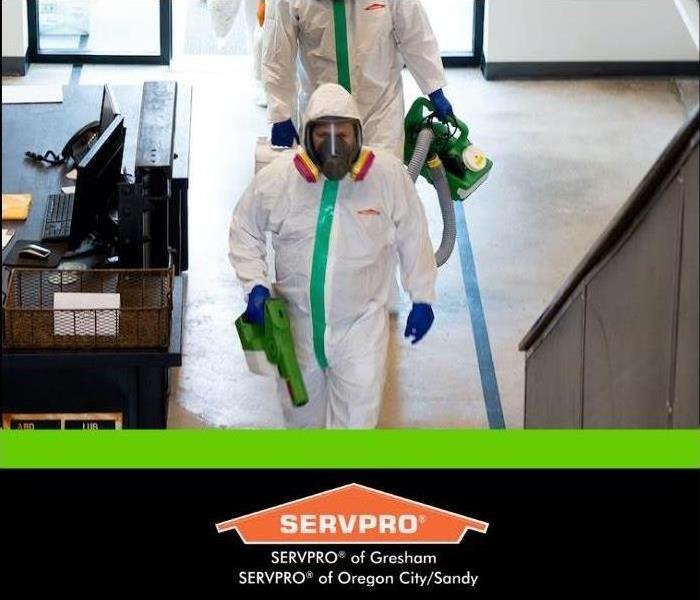 techs in PPE walking into commercial space 
